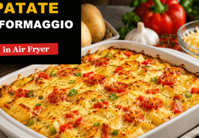 Patate al formaggio in air fryer con patate dorate, formaggio fuso, pomodorini e peperoni