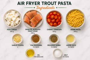 Ingredients for Air Fryer Trout Pasta including feta cheese, skinless boneless trout, cherry tomatoes, penne pasta, garlic, fish seasoning, Provence herbs, lemon juice, oil, and salt